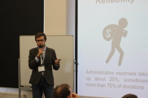 A student pitches his team's idea for an app that makes it simple and secure to make charity donations.