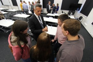 Mentor Novica Mrdovic talks to students following the pitch sessions on Tuesday.