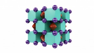 Crystal structure of Na2He, resembling a three-dimensional checkerboard. The purple spheres represent sodium atoms, which are inside the green cubes that represent helium atoms. The red regions inside voids of the structure show areas where localized electron pairs reside. Illustration is provided courtesy of Artem R. Oganov.