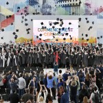 Skoltech graduates and faculty members toss their graduation caps in the air after the 2017 commencement ceremony.