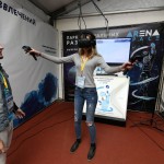 A young scientist tests out a virtual reality mask at the Startup Village.