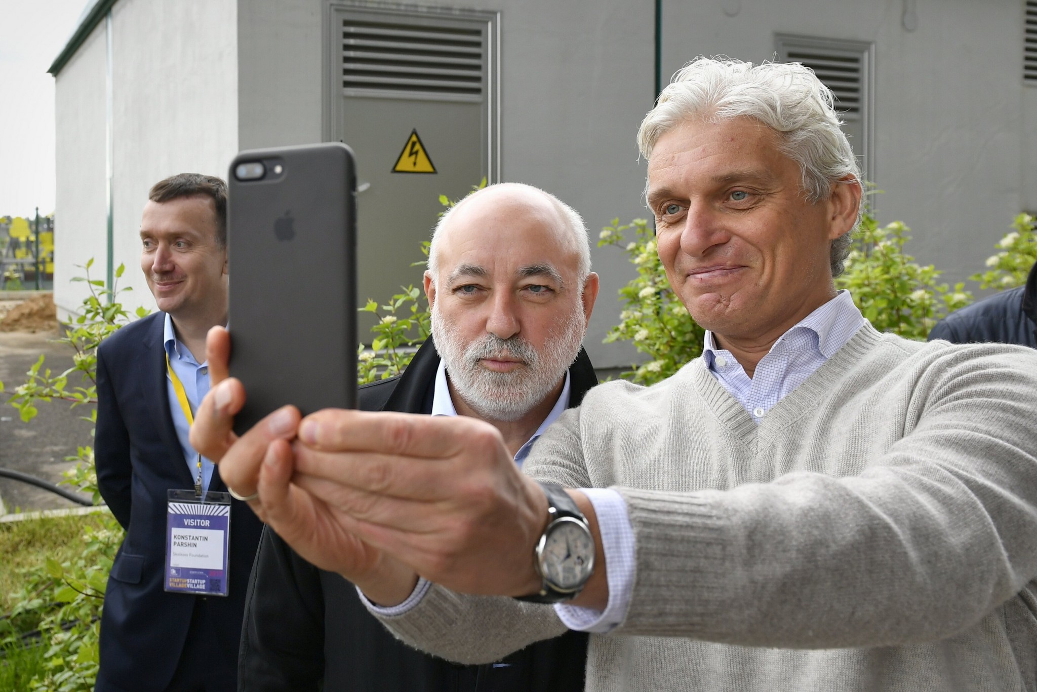 Skolkovo Foundation President Victor Vekselberg and entrepreneur Oleg Tinkov take a selfie together during the Startup Village.