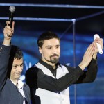 Professor Artem Oganov (left) waves to the audience alongside popstar Dima Bilan during the opening ceremony of the World Festival of Youth and Students in Sochi. Photo: Francesca Nesterenko // Facebook.