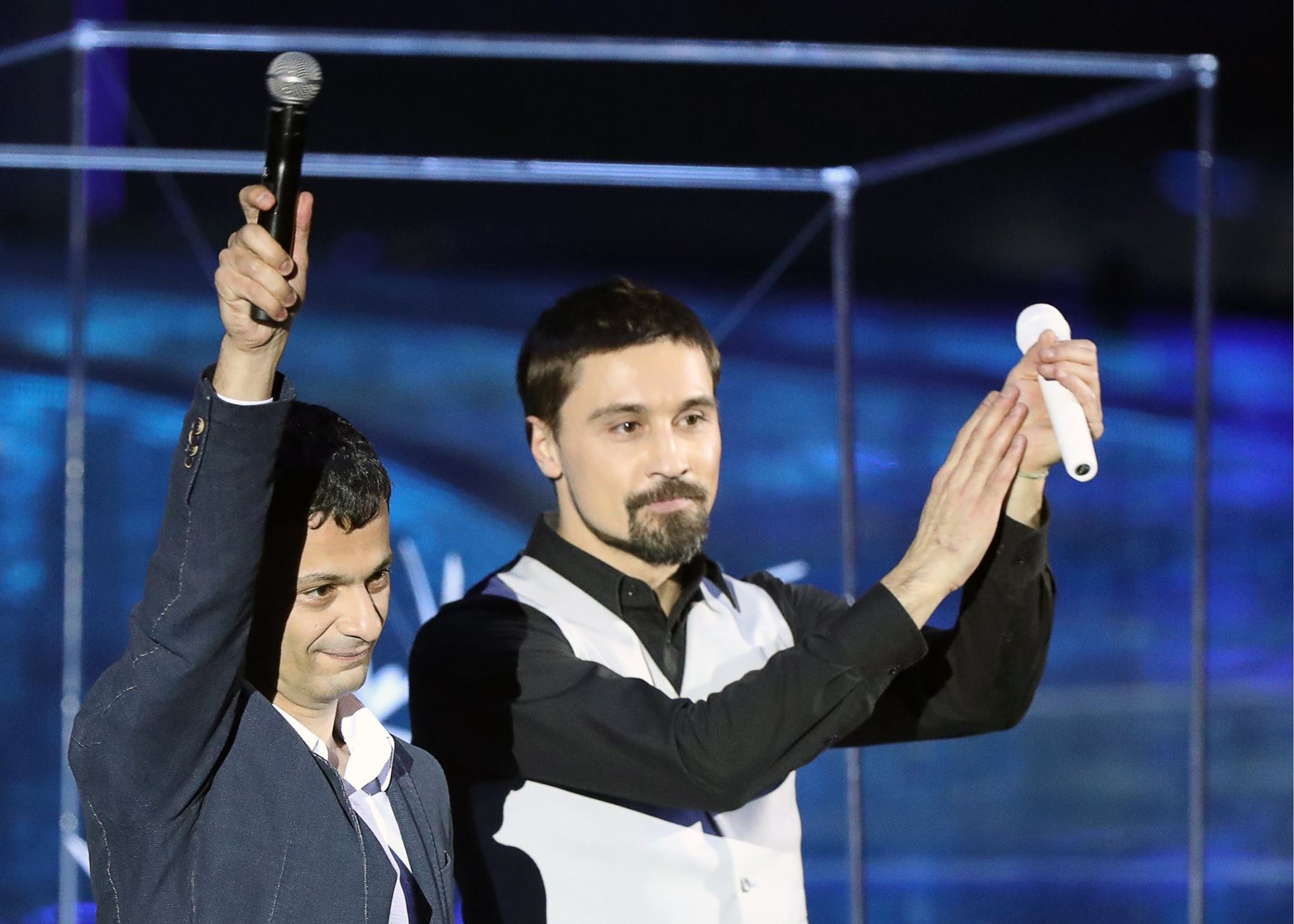 Professor Artem Oganov (left) waves to the audience alongside popstar Dima Bilan during the opening ceremony of the World Festival of Youth and Students in Sochi. Photo: Francesca Nesterenko // Facebook.