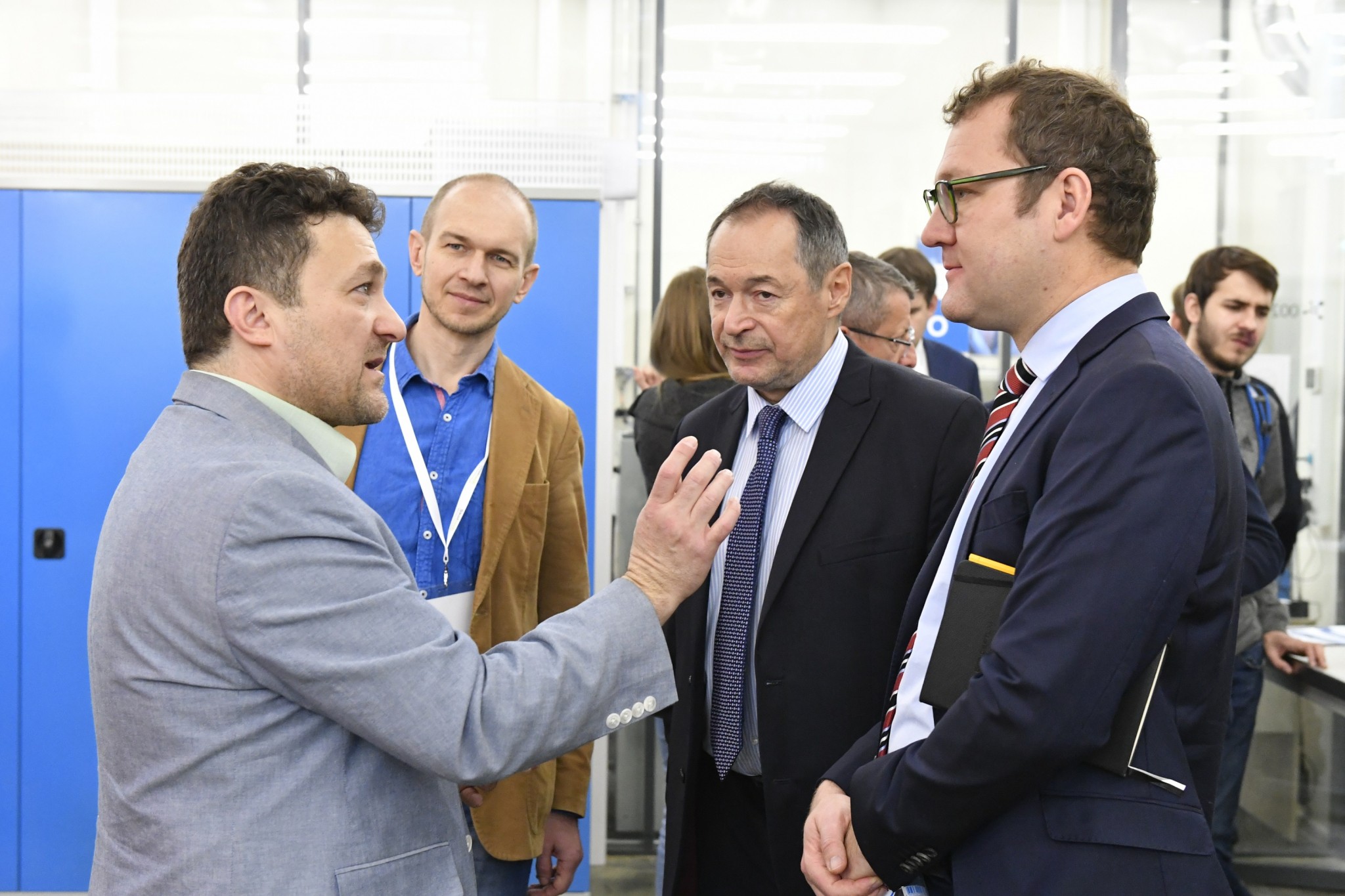 North Dakota State University Professor Fardad Azarmi (far left) talks shop with Professor Iskander Akhatov (second to right) and Florian Mauerer, a senior vice president and head of additive manufacturing at Oerlikon (far right). Photo: Skoltech.