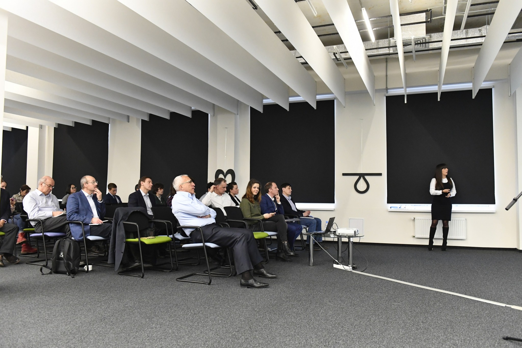 Members of Skoltech's leadership, including President Alexander Kuleshov and Provost Rupert Gerzer, watch a presentation. Photo: Skoltech.
