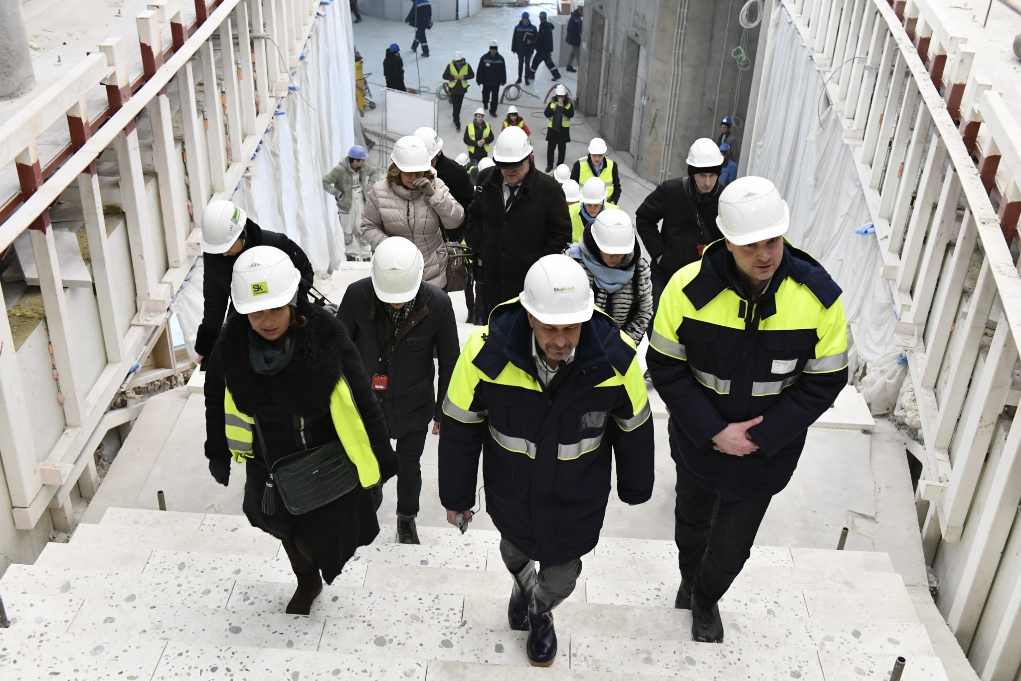 Skoltech Vice President for Real Estate and Facilities Gary Wentworth leads CDIO members on a tour of the new building. Photo: Skoltech.