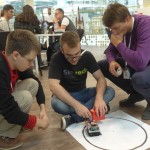 Students prepare a self-driving inventory robot for the Innovation Workshop’s Internet of Things (IoT) exercise.