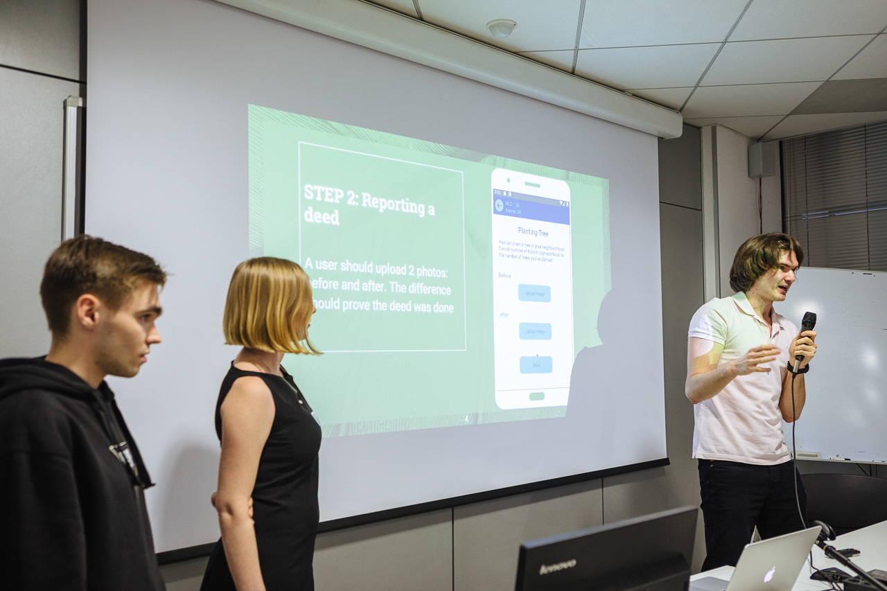 Final presentation – Vlad, Lyubov and Ivan (with mic), Wild Hunchers team, at University of the Republic of San Marino