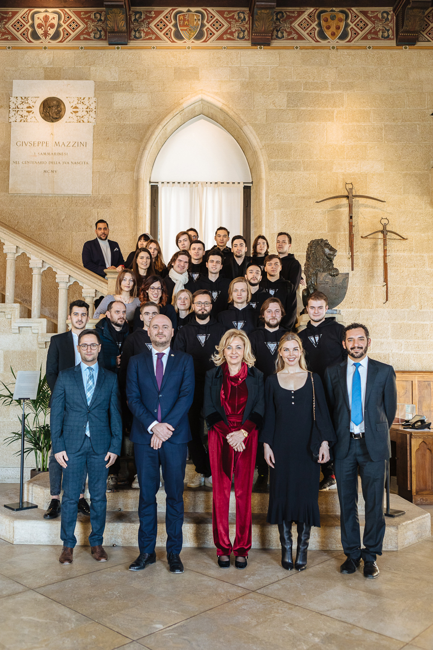 J9 – Skoltech students and Nulan team with highest officlas of San Marino (first row, from the left): Fabio Righi, the Minister of Industry and Technological Research, Luca Boschi and Mariella Mularoni the Captains Regent, Ellen Quirk Founder & CEO of Kismet Impact Capital, Samir Mastaki, CEO Nuland; At the parliament of the Republic of San Marino