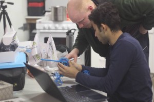 Crew engineers working on the robot “Red ARM 1”.